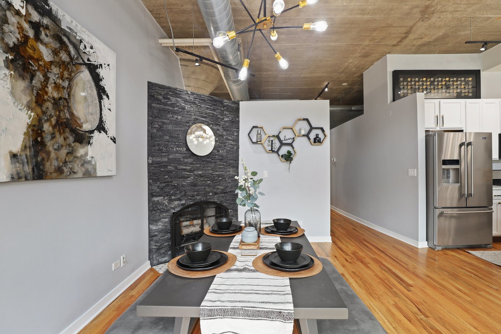 1111 West 15th Street, Unit 113 Chicago, IL 60608 - Photo 5 of 34 a room with furniture and wooden floor