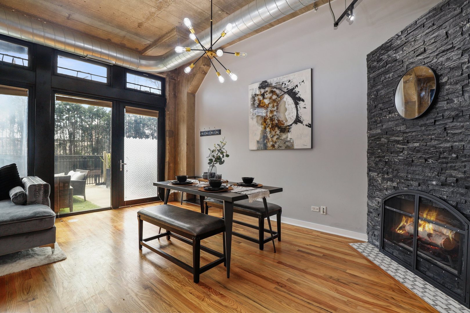 1111 West 15th Street, Unit 113 Chicago, IL 60608 - Photo 10 of 34 a living room with furniture and a fireplace