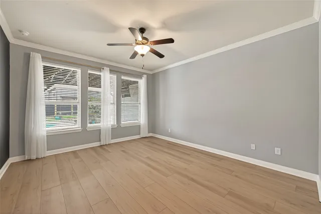 a bed room with a bed and a window