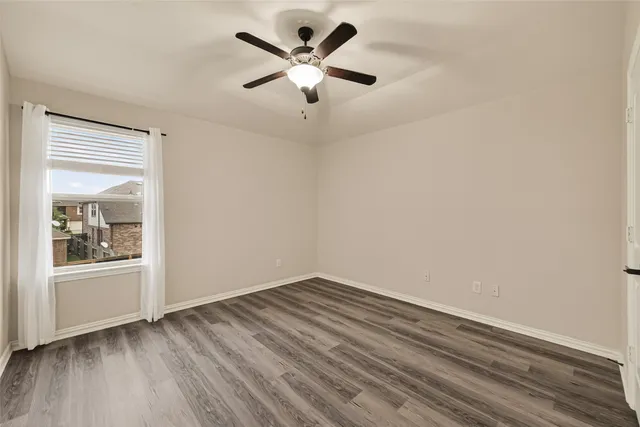 a room with furniture pool table and windows