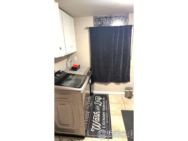 a room with a sink and cabinets
