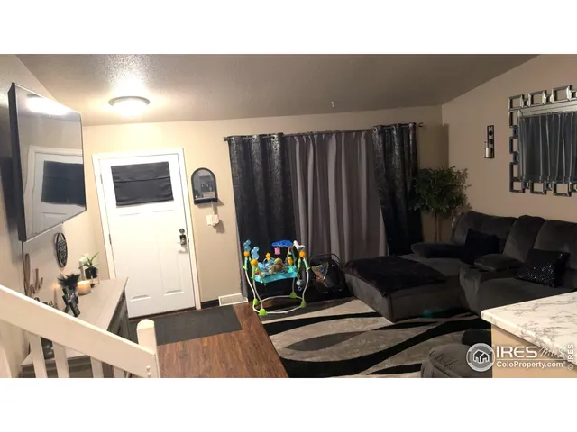 a bedroom with a bed and a ceiling fan