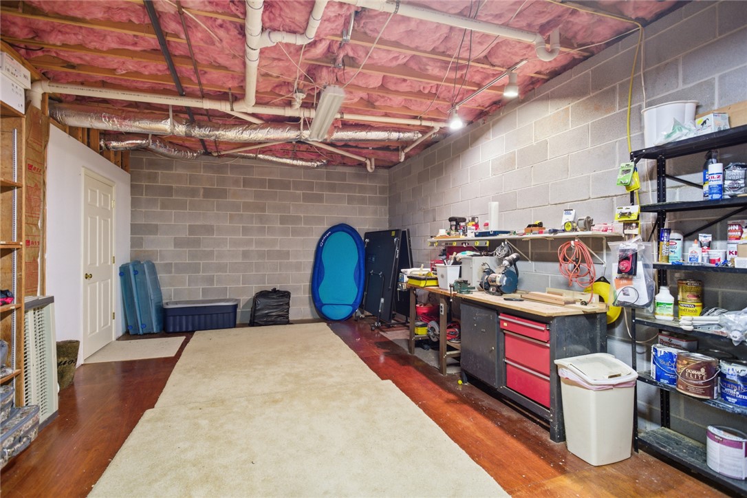 6 Tradewinds Way Salem, SC 29676 - Photo 27 of 50 This spacious, unfinished basement offers versatile space with durable block walls and warm hardwood flooring.