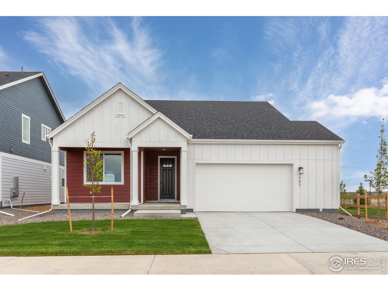 797 Muturu Road Johnstown, CO 80534 - Photo 1 of 26 a front view of a house with a yard