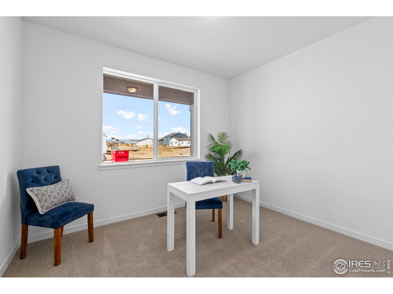 797 Muturu Road Johnstown, CO 80534 - Photo 13 of 26 a dining room with furniture and window