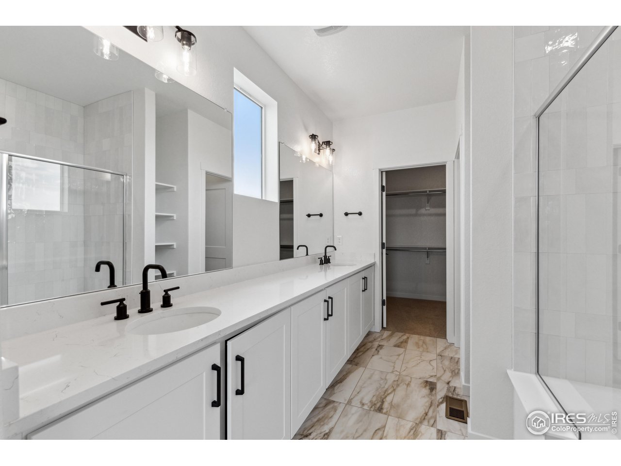 797 Muturu Road Johnstown, CO 80534 - Photo 16 of 26 a kitchen with a sink and refrigerator