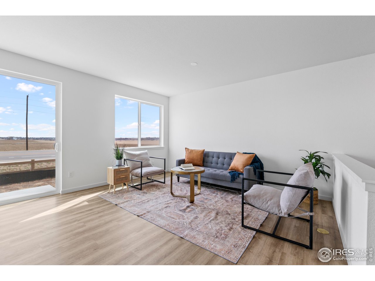 797 Muturu Road Johnstown, CO 80534 - Photo 5 of 26 a living room with furniture and a table