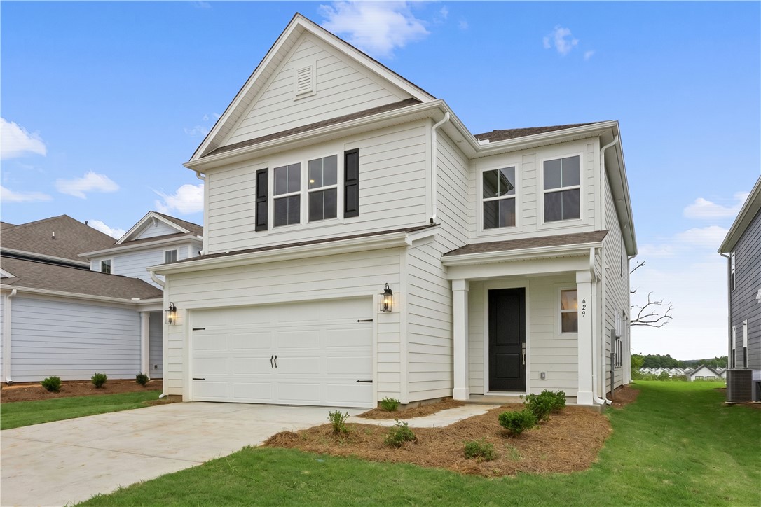 629 Sweetspire Trail, Unit 149 Seneca, SC 29678 - Photo 2 of 30 A pristine two-story residence with a welcoming front entrance and an attached garage.