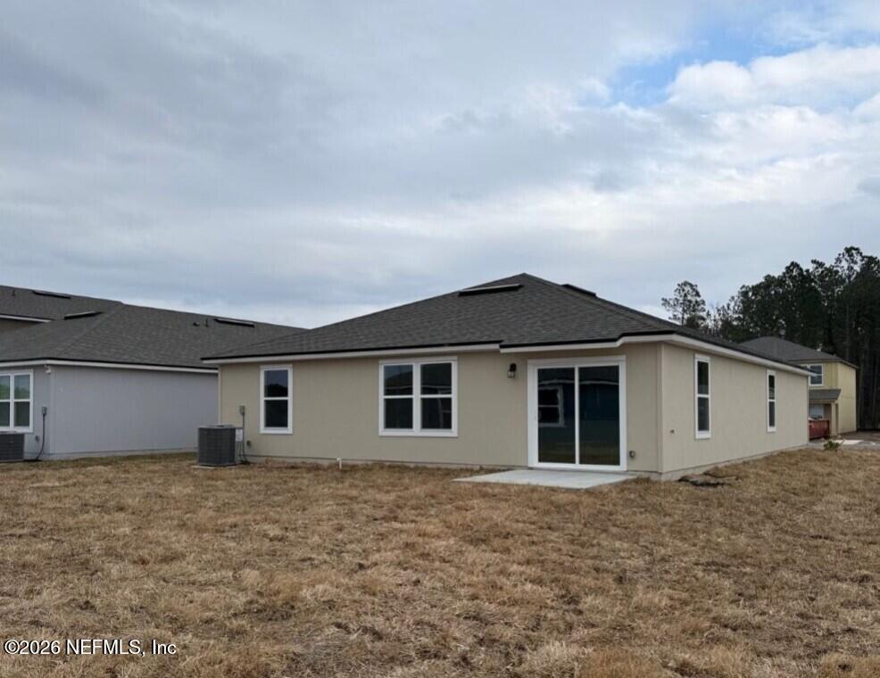 12420 Russian Olive Road Jacksonville, FL 32218 - Photo 7 of 36 a view of a house with a backyard