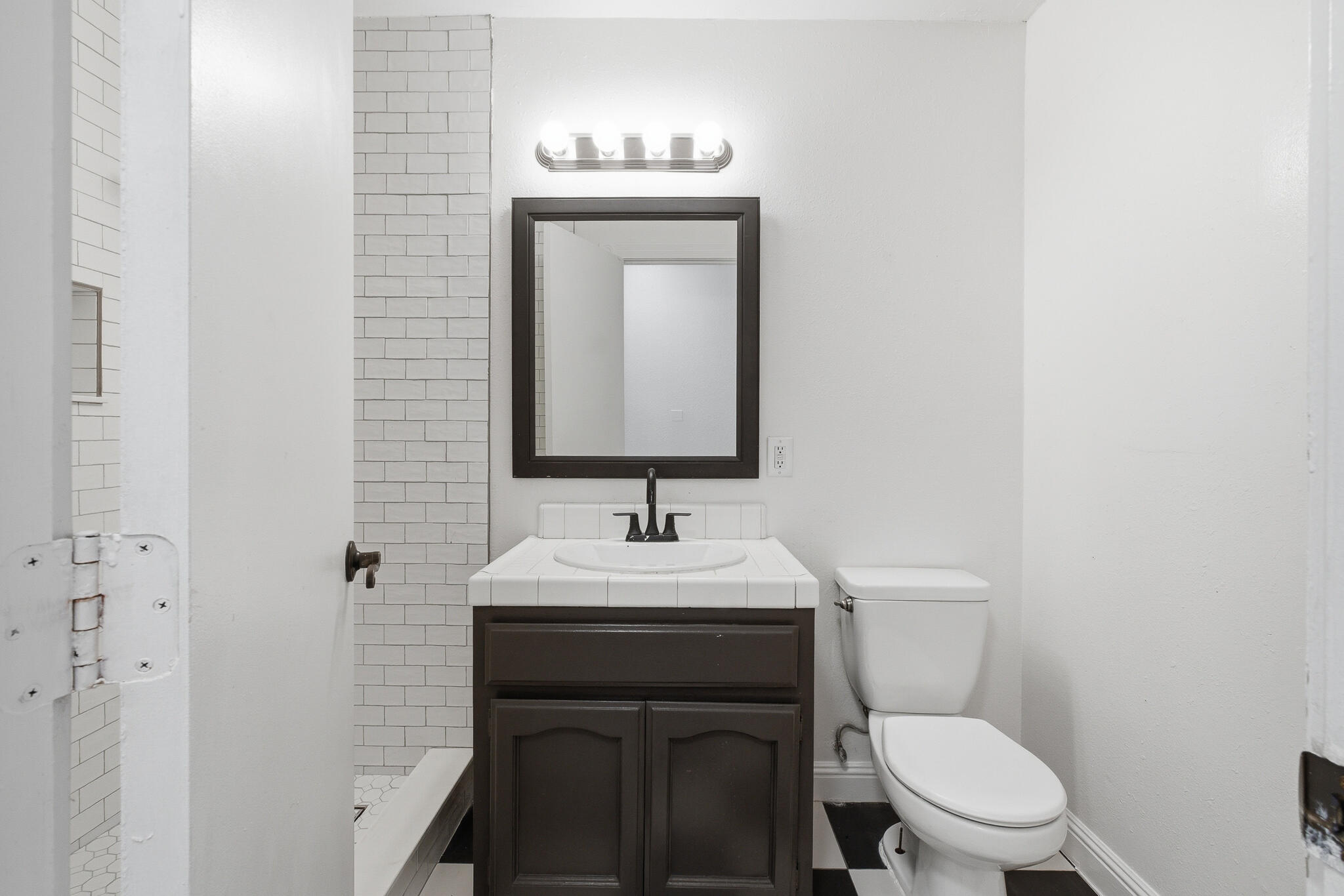 618 Birdsong Court Exeter, CA 93221 - Photo 28 of 62 a bathroom with a toilet sink and mirror