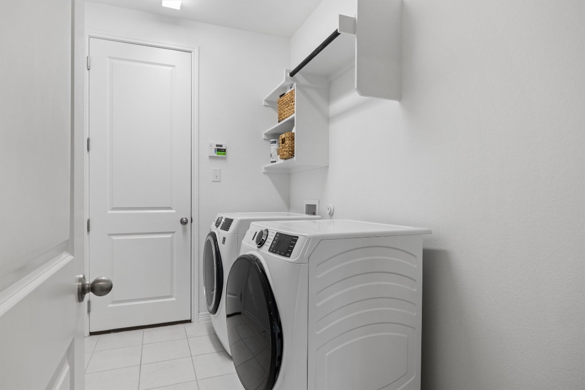1132 Spring Gulch Lane Georgetown, TX 78628 - Photo 13 of 36 a utility room with dryer and washer