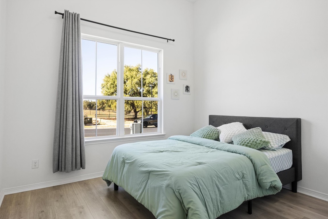 1132 Spring Gulch Lane Georgetown, TX 78628 - Photo 5 of 36 a bedroom with a bed and a window