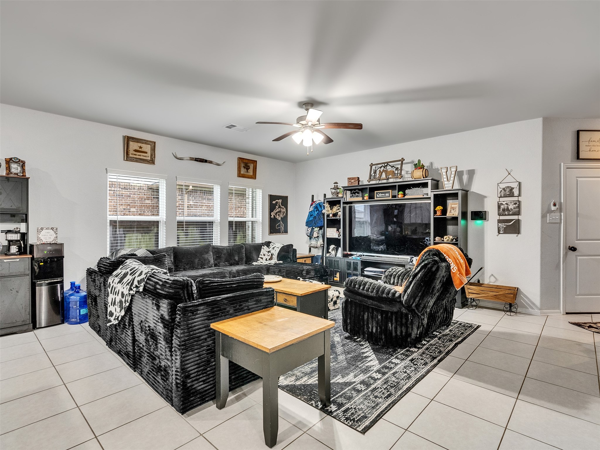 8719 Willet Street Baytown, TX 77521 - Photo 12 of 42 a bedroom with furniture and a window