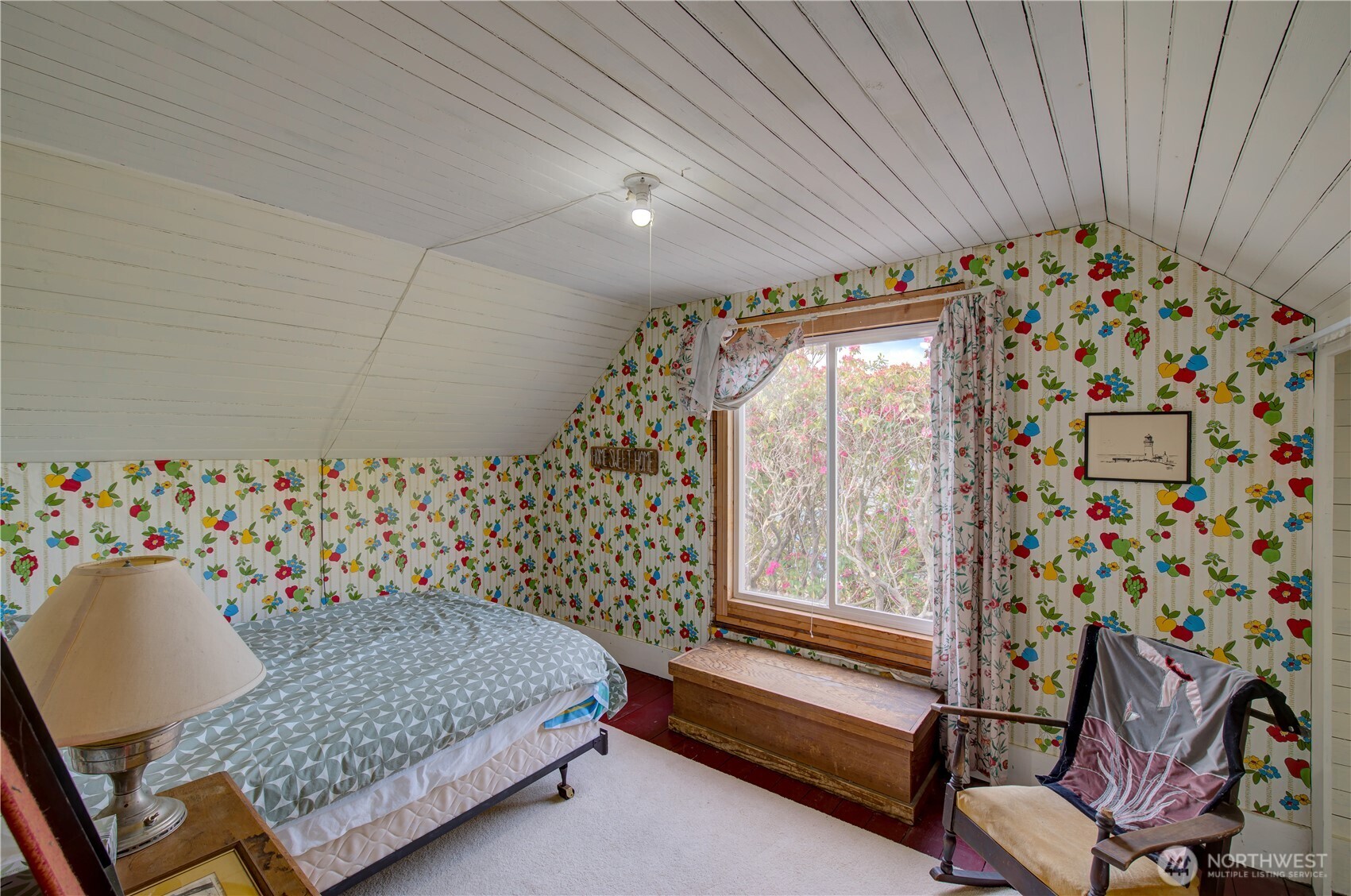 209 3rd Street Southeast Long Beach, WA 98631 - Photo 15 of 28 a bedroom with a bed and a chair