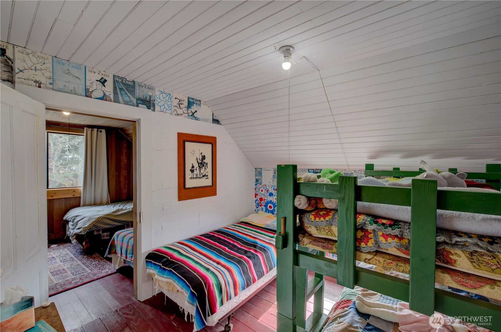 209 3rd Street Southeast Long Beach, WA 98631 - Photo 18 of 28 a bedroom with bed and a bookshelf