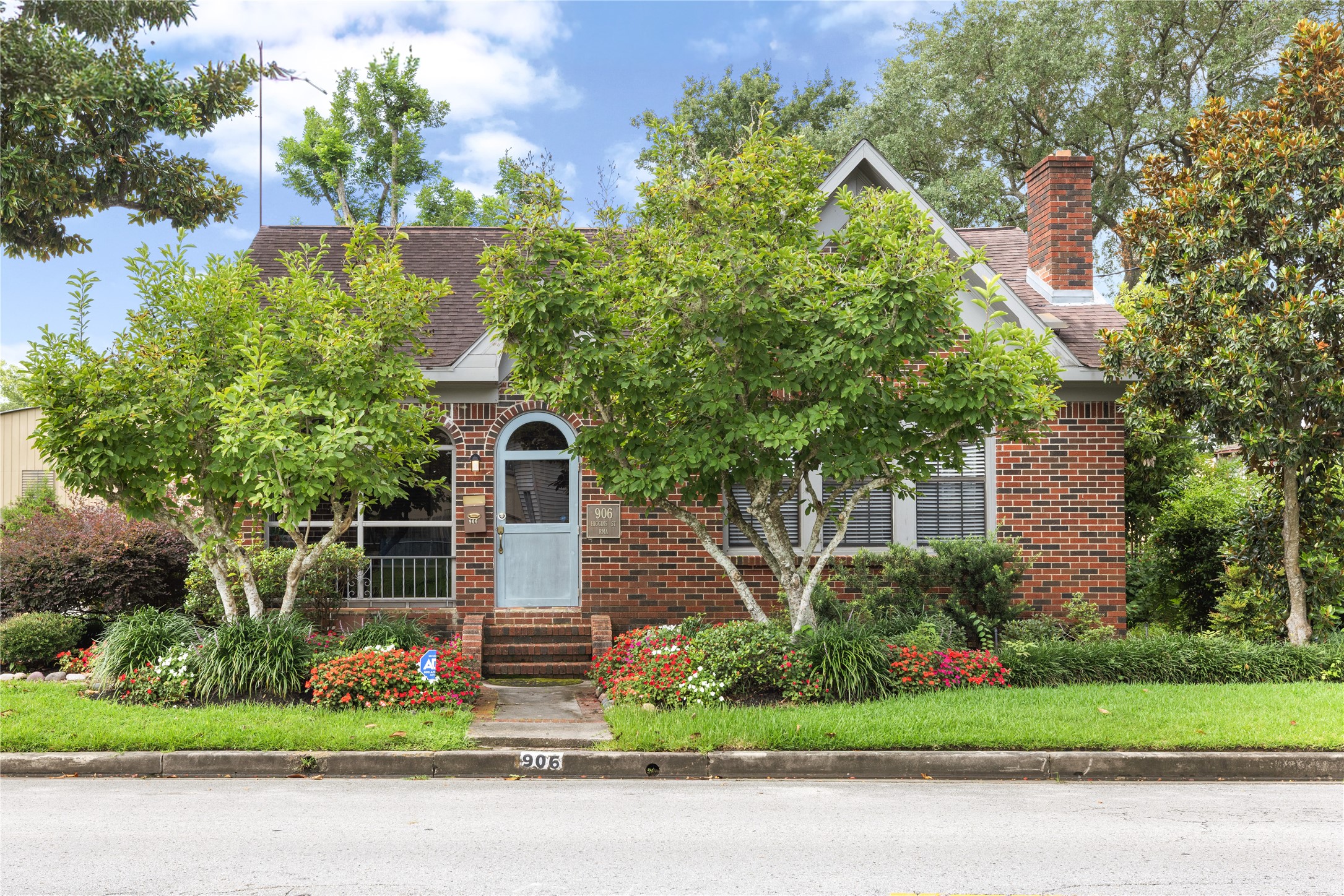 Lovely brick home with a classic look, lush landscaping and mature trees. The inviting front entrance framed by vibrant greenery and colorful flowers, creating excellent curb appeal.Consider this for commercial or residential use.