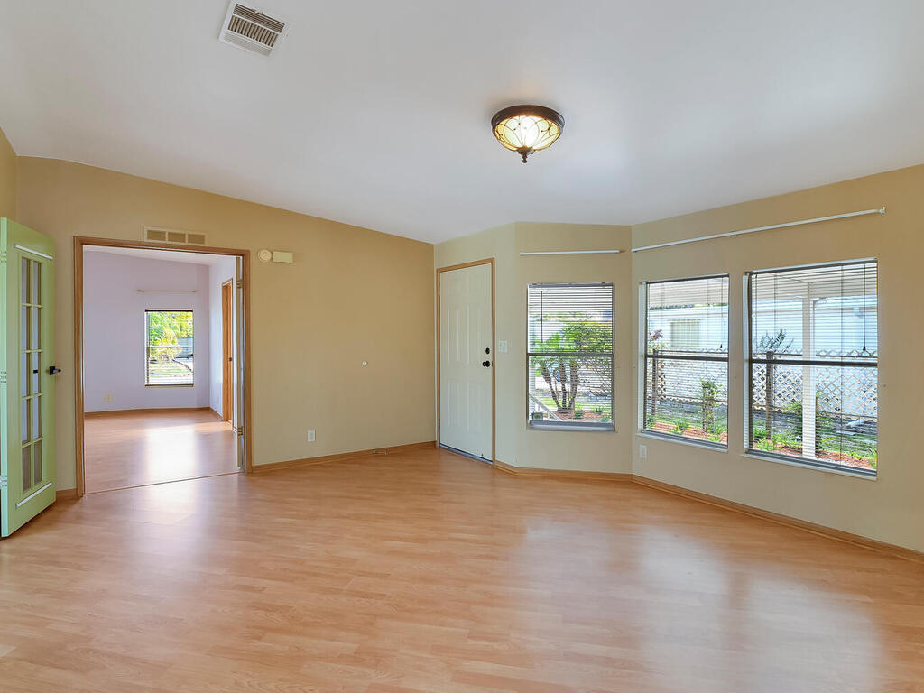 269 Riverwood Road Naples, FL 34114 - Photo 16 of 32 an empty room with windows