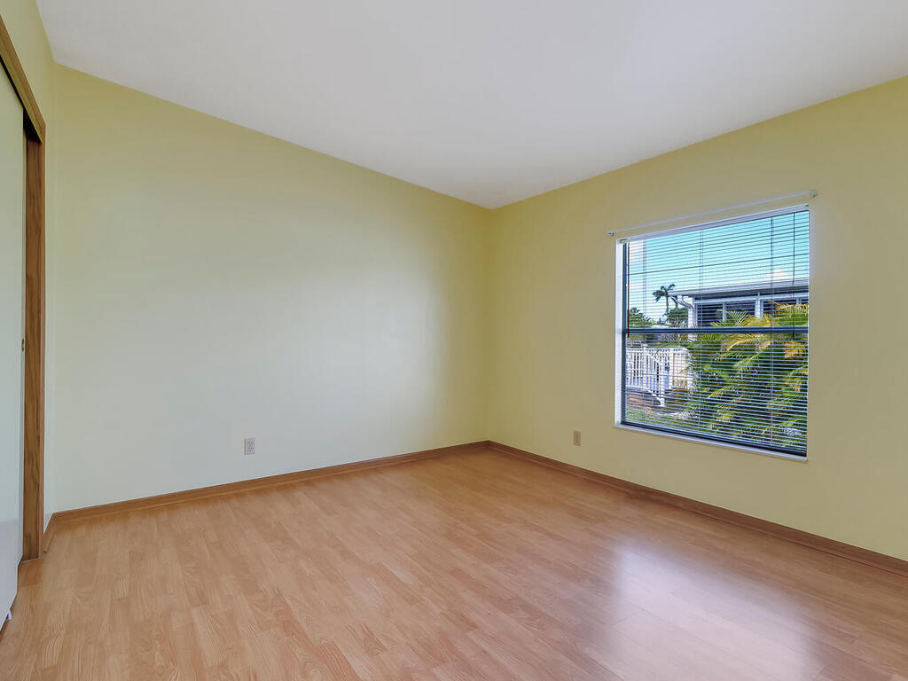 269 Riverwood Road Naples, FL 34114 - Photo 21 of 32 an empty room with windows