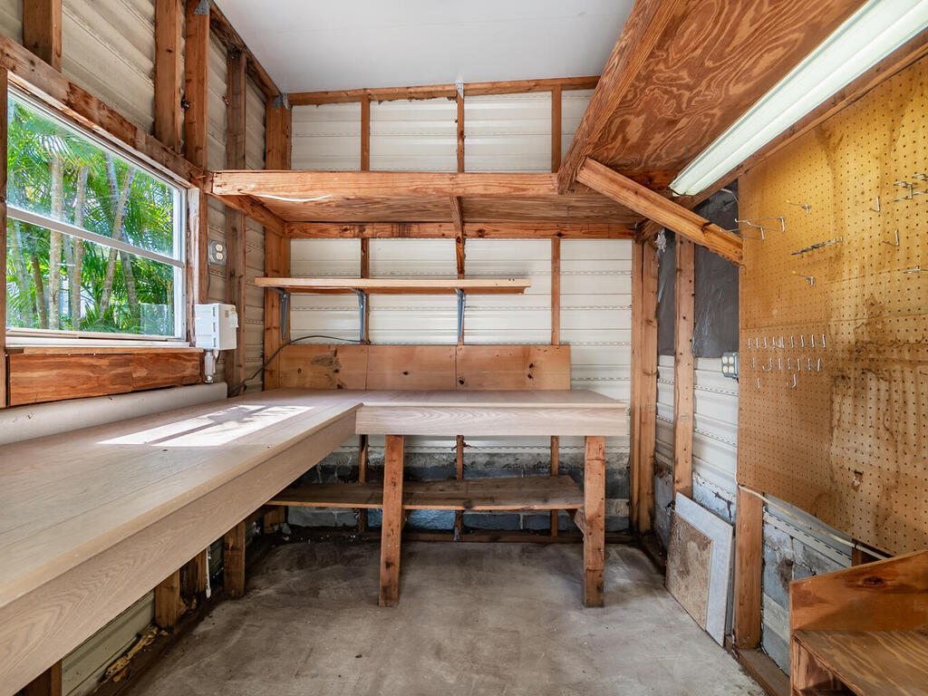 269 Riverwood Road Naples, FL 34114 - Photo 24 of 32 a view of balcony with a table and chairs
