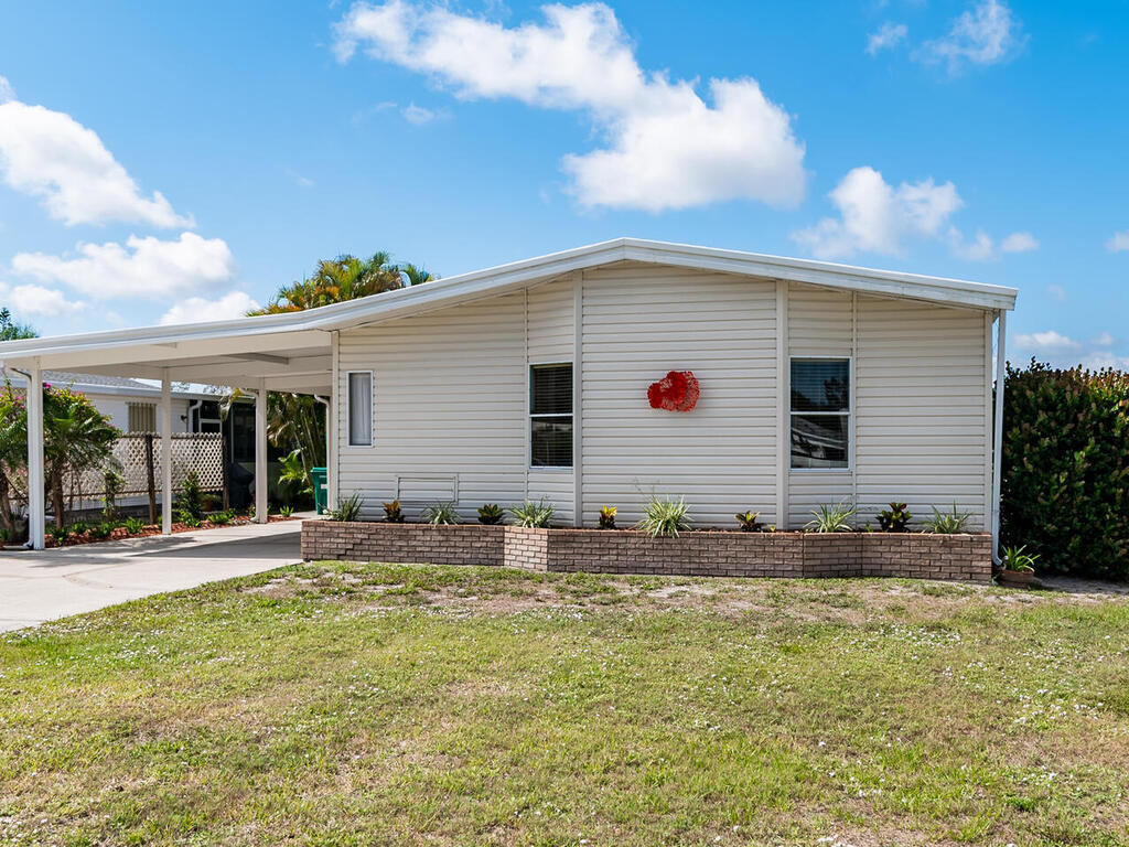 269 Riverwood Road Naples, FL 34114 - Photo 32 of 32 a front view of house with yard