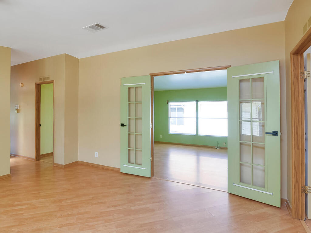 269 Riverwood Road Naples, FL 34114 - Photo 6 of 32 an empty room with windows and closet