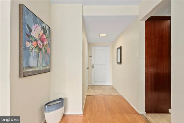 a view of a hallway with bathroom