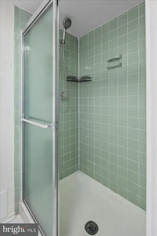 a view of balcony with wooden floor and fence
