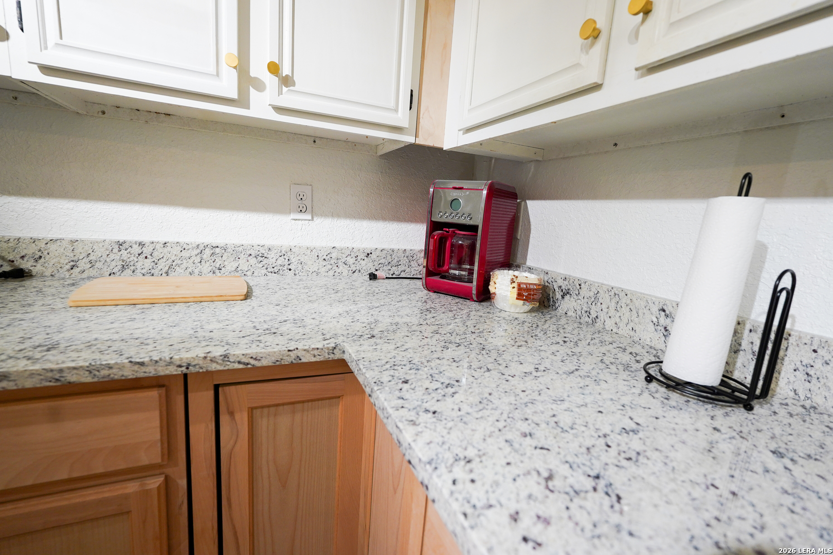 1823 Copperfield Road San Antonio, TX 78251 - Photo 13 of 25 a kitchen with granite countertop a sink a stove and a granite counter top