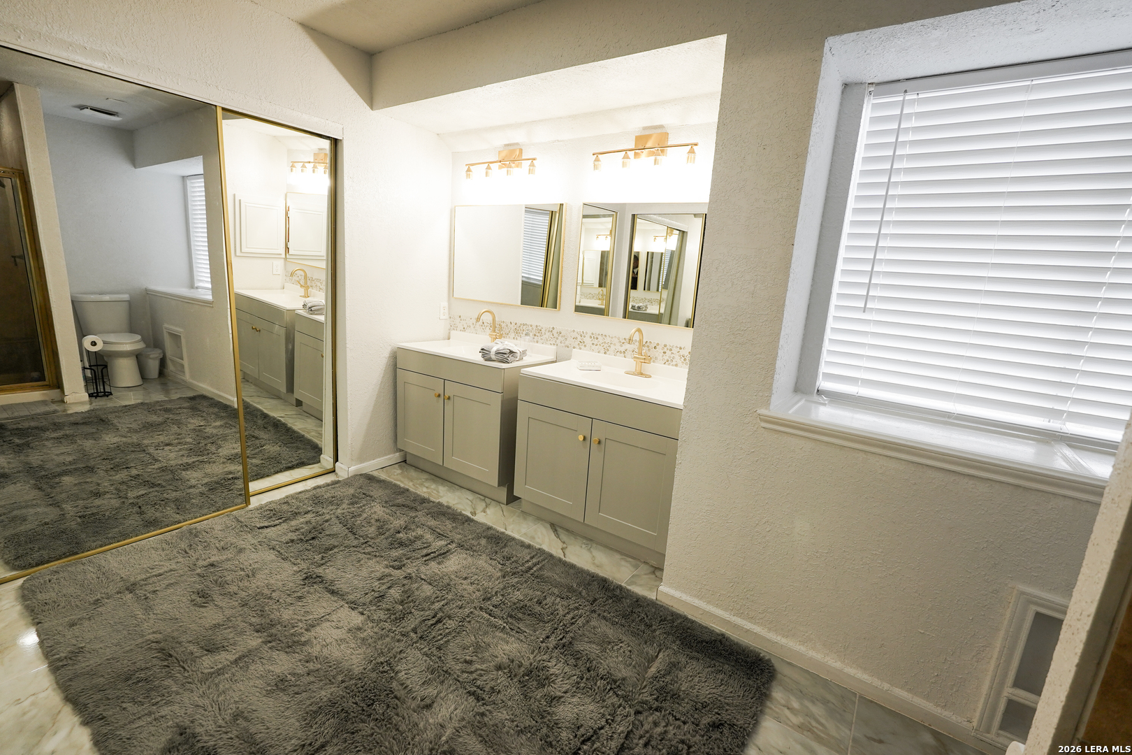 1823 Copperfield Road San Antonio, TX 78251 - Photo 18 of 25 a bathroom with a sink a toilet and a shower