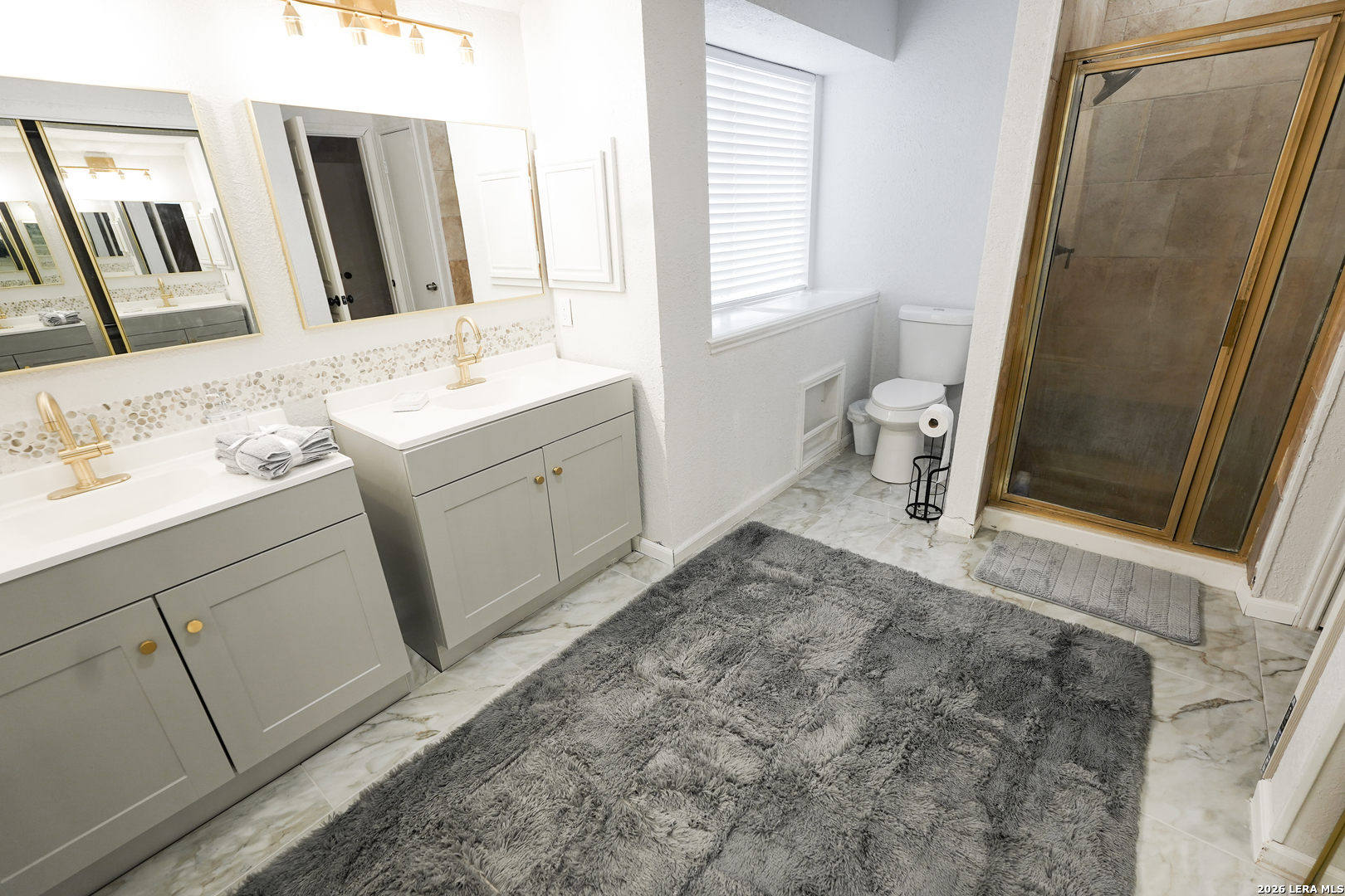 1823 Copperfield Road San Antonio, TX 78251 - Photo 19 of 25 a bathroom with a sink a toilet and a mirror