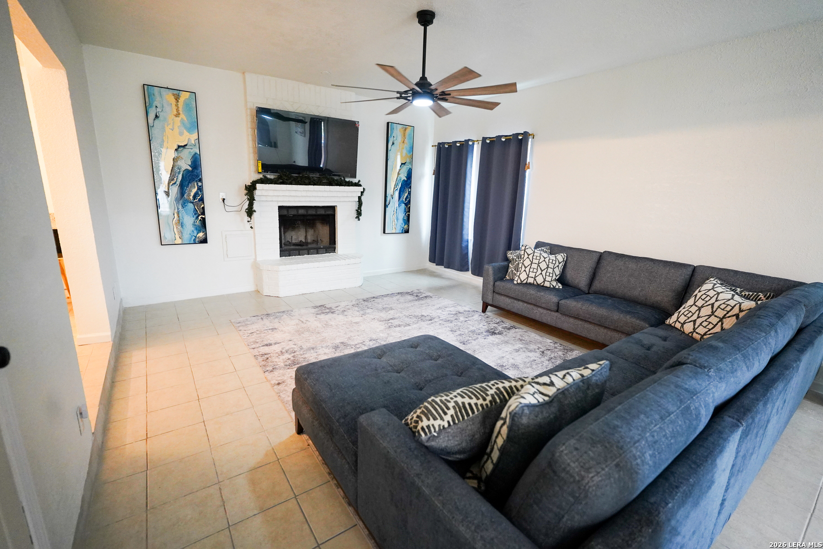 1823 Copperfield Road San Antonio, TX 78251 - Photo 6 of 25 a living room with furniture and a flat screen tv