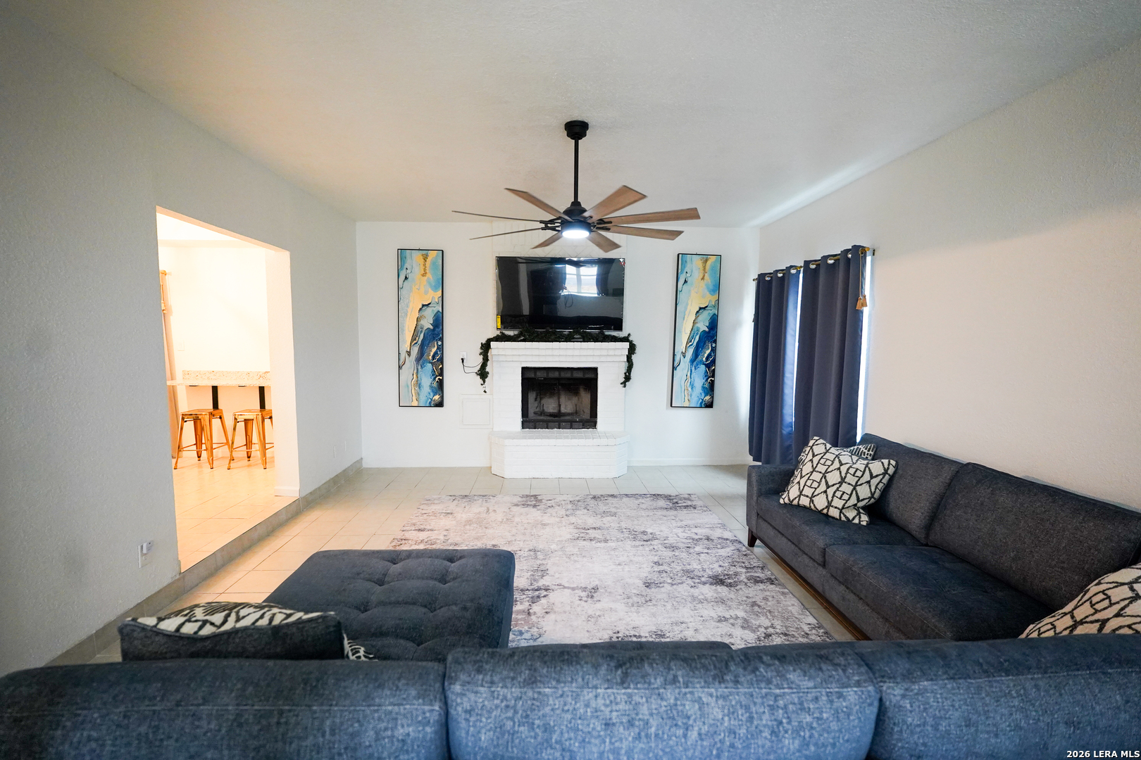 1823 Copperfield Road San Antonio, TX 78251 - Photo 7 of 25 a living room with furniture and a fireplace