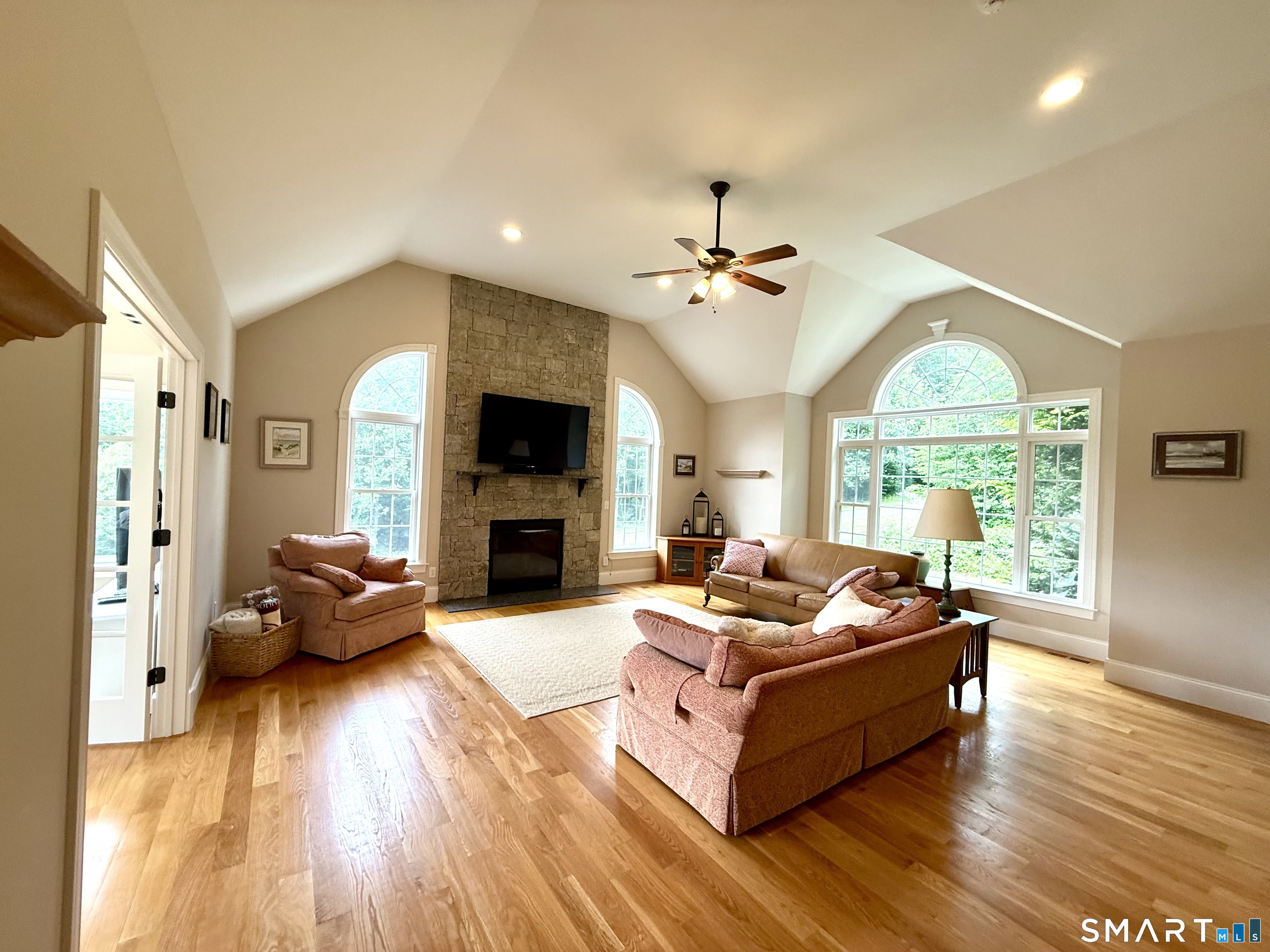 46 Hoseye Coach Road Newtown, CT 06482 - Photo 5 of 36 large great room with stone fireplace and volume ceiling