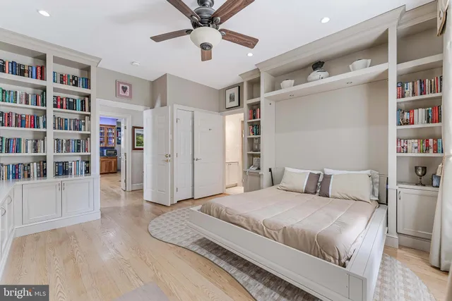 a kitchen with stainless steel appliances granite countertop a refrigerator a stove and oven with wooden floor