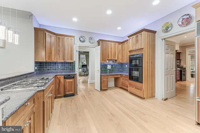 a bedroom with a large bed couch and a window