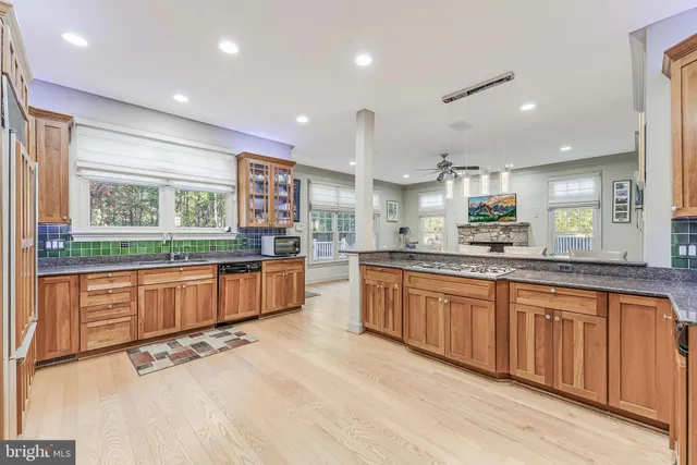 a spacious bedroom with a bed a table and chair