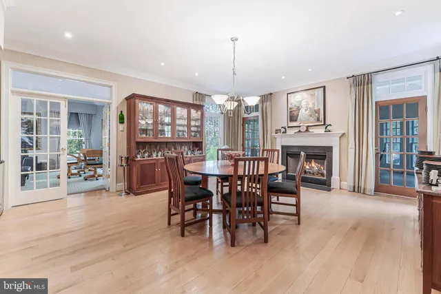 a spacious bedroom with a bed a table and chair