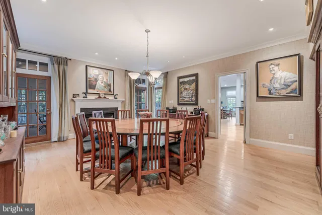 a view of a hallway with wooden floor and furniture