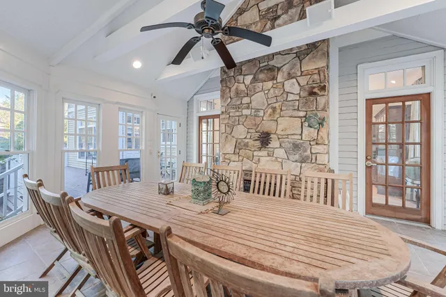 a view of a dining room with furniture and a kitchen