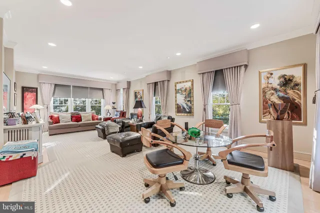 a spacious bedroom with a bed and a television