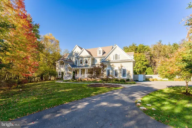 a view of a patio with a table and chairs and floor to ceiling window