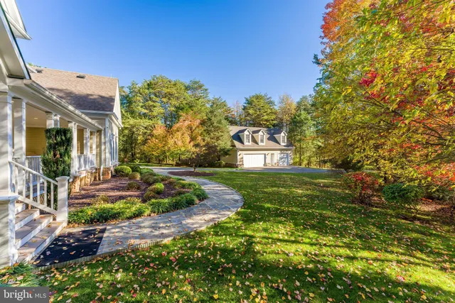 a spacious bedroom with a bed cabinets and a book shelf