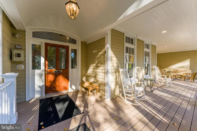 a view of a livingroom with workspace and a window