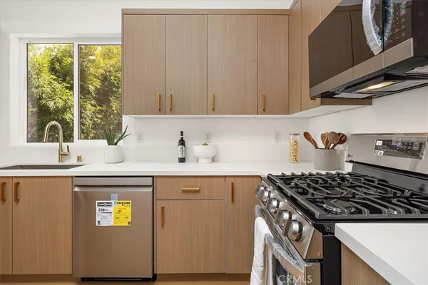 a kitchen with a stove and a microwave