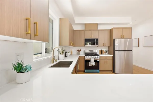 a kitchen with sink and window