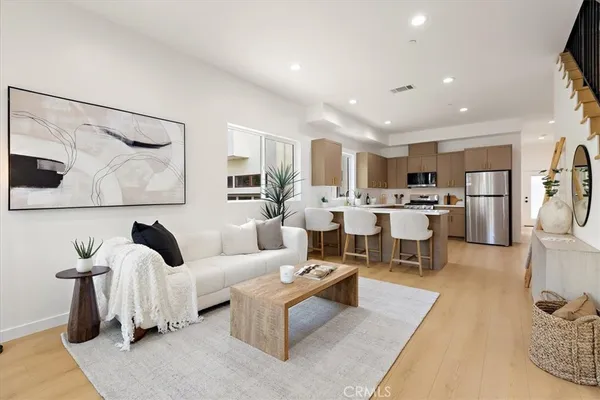 a living room with furniture and a table