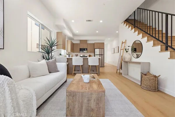 a living room with furniture and a clock