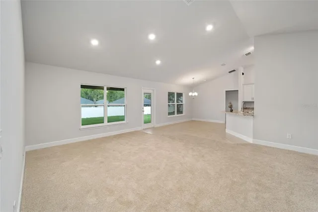 a kitchen with stainless steel appliances kitchen island granite countertop a stove and a sink
