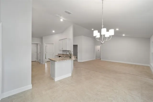 a kitchen with a sink stainless steel appliances and cabinets