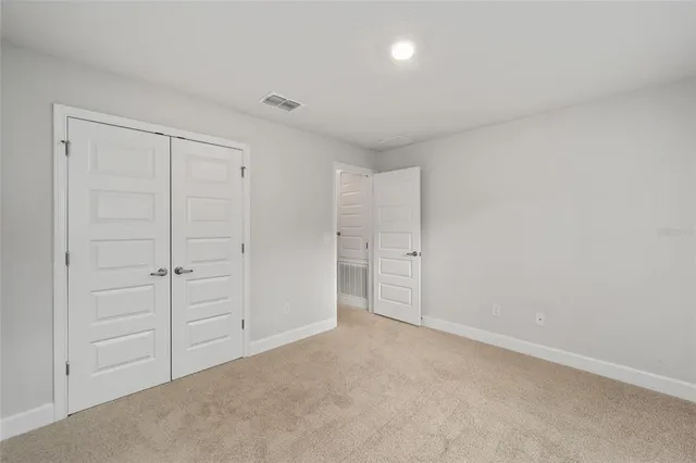 a view of empty room with windows